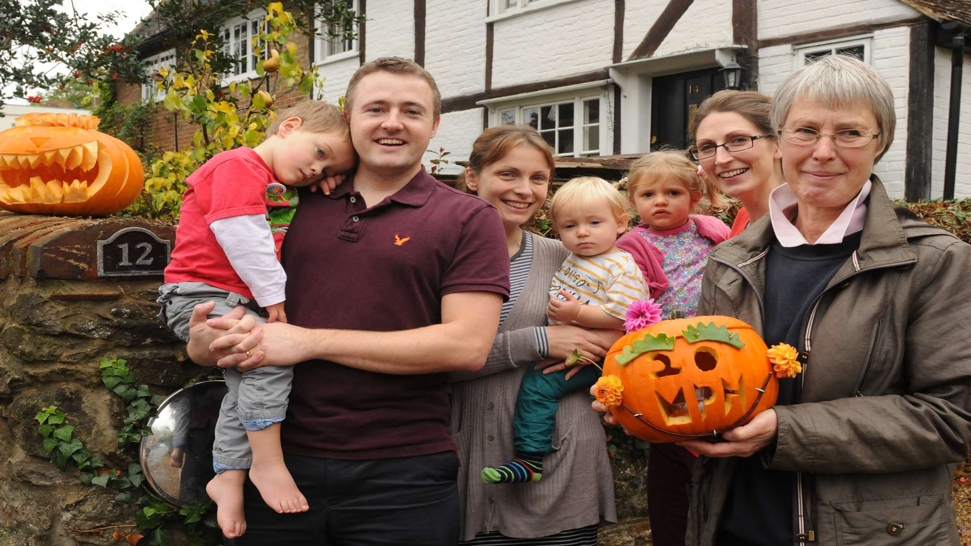 Pumpkins carved with speeding messages. Neighbours Nick and Becky Prince with Edward and Henry, Eleanor and Clara Loveday and Hilary Dowling