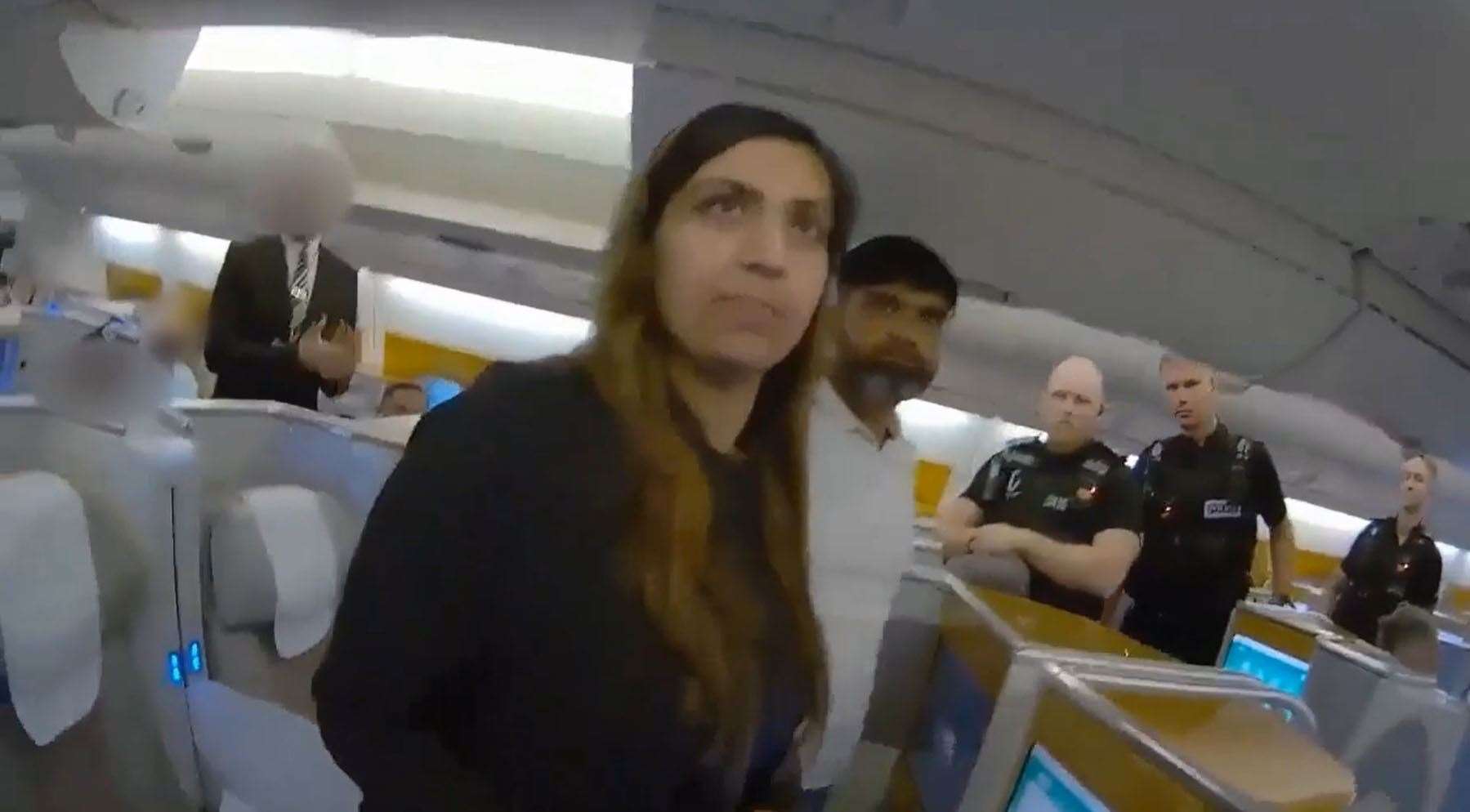 Screen grab from body cam footage of the moment police officers boarded a plane and detained Sara Sharif’s stepmother Beinash Batool (Surrey Police/PA)