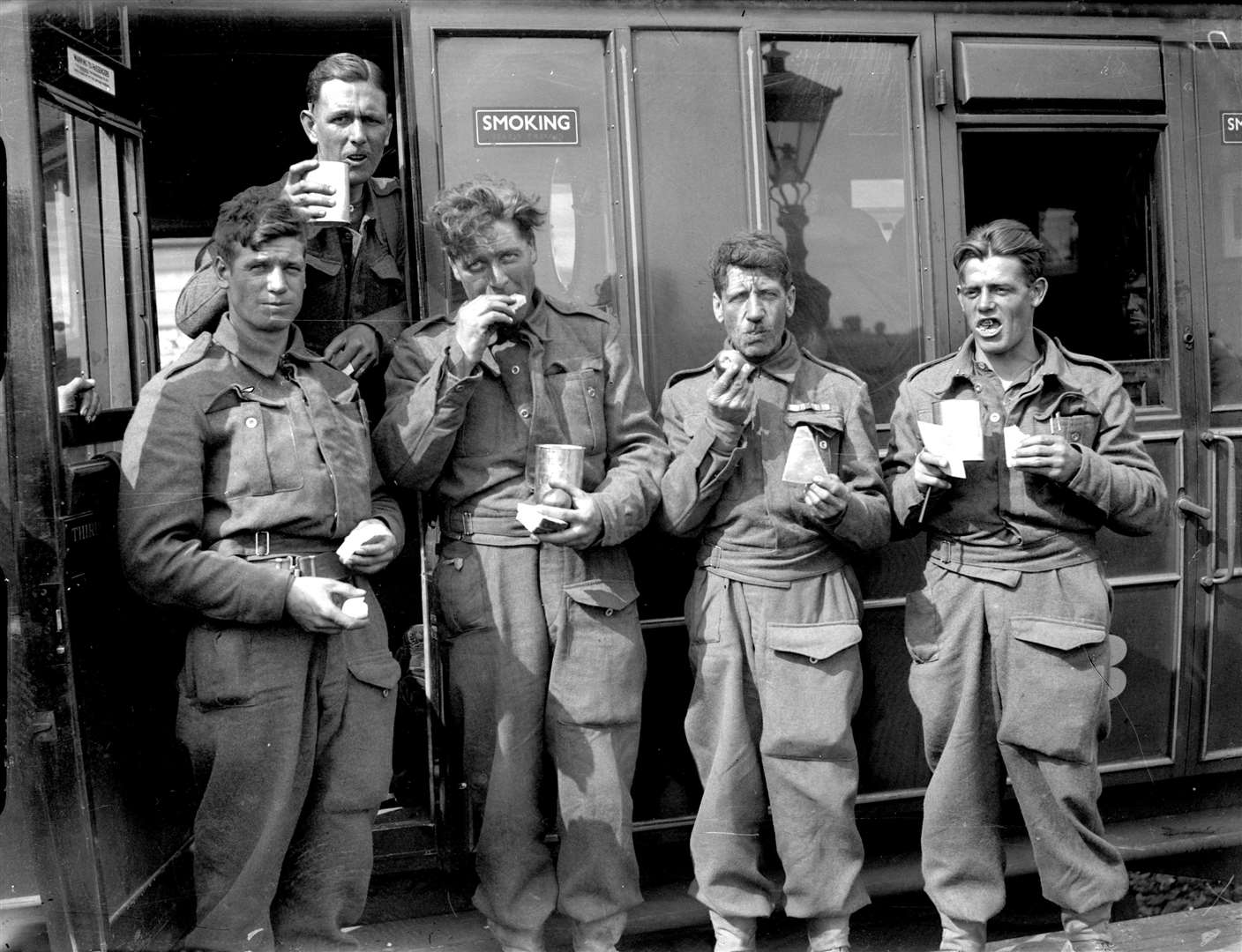 Members of the British Expeditionary Force with tea in cans from the canning factory