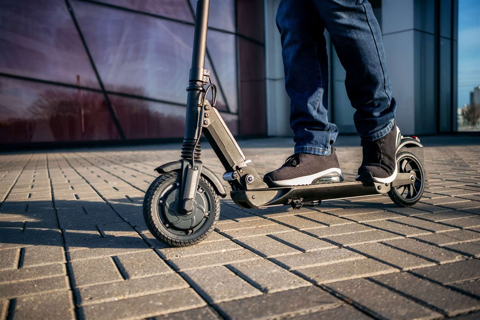 One reader describes being hit by an e-scooter. Library image