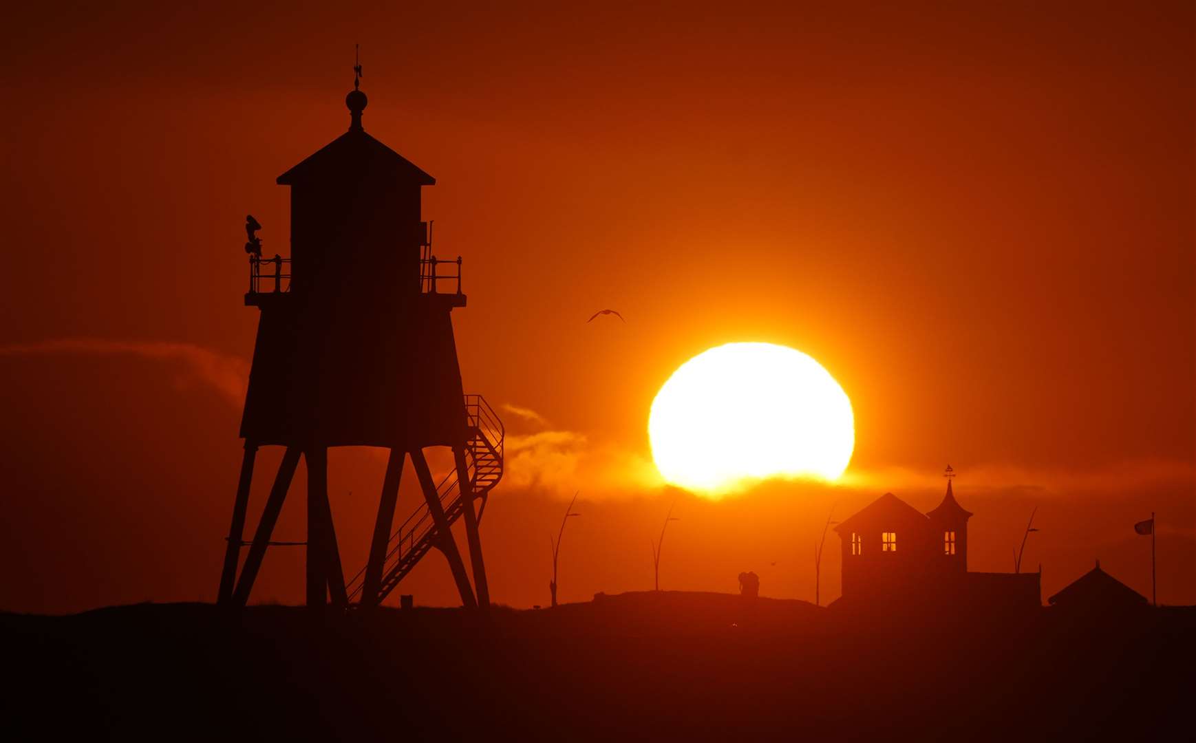 The day began with bright sunshine in places such as South Shields, seen here at sunrise (Owen Humphreys/PA)