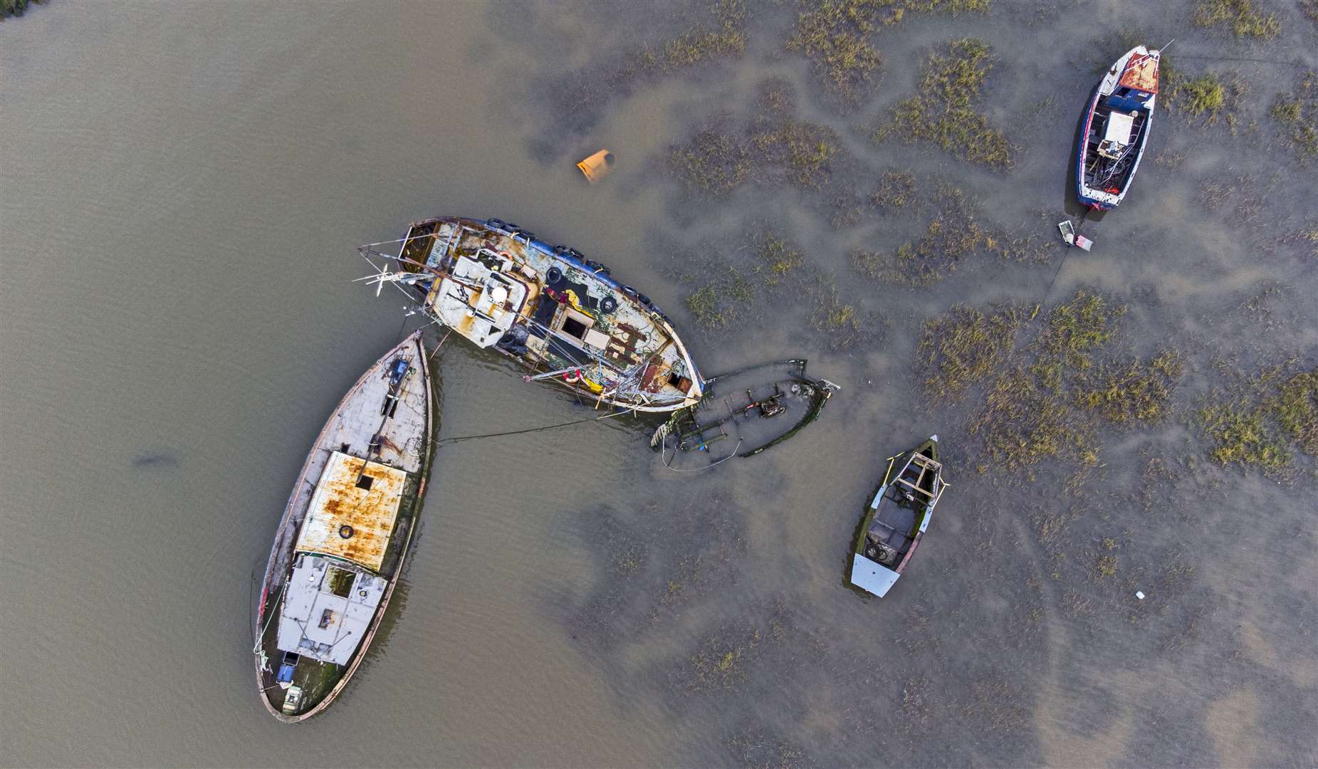 Fishing boats lie in the waters of the River Wyre at Fleetwood in Lancashire (Peter Byrne/PA)