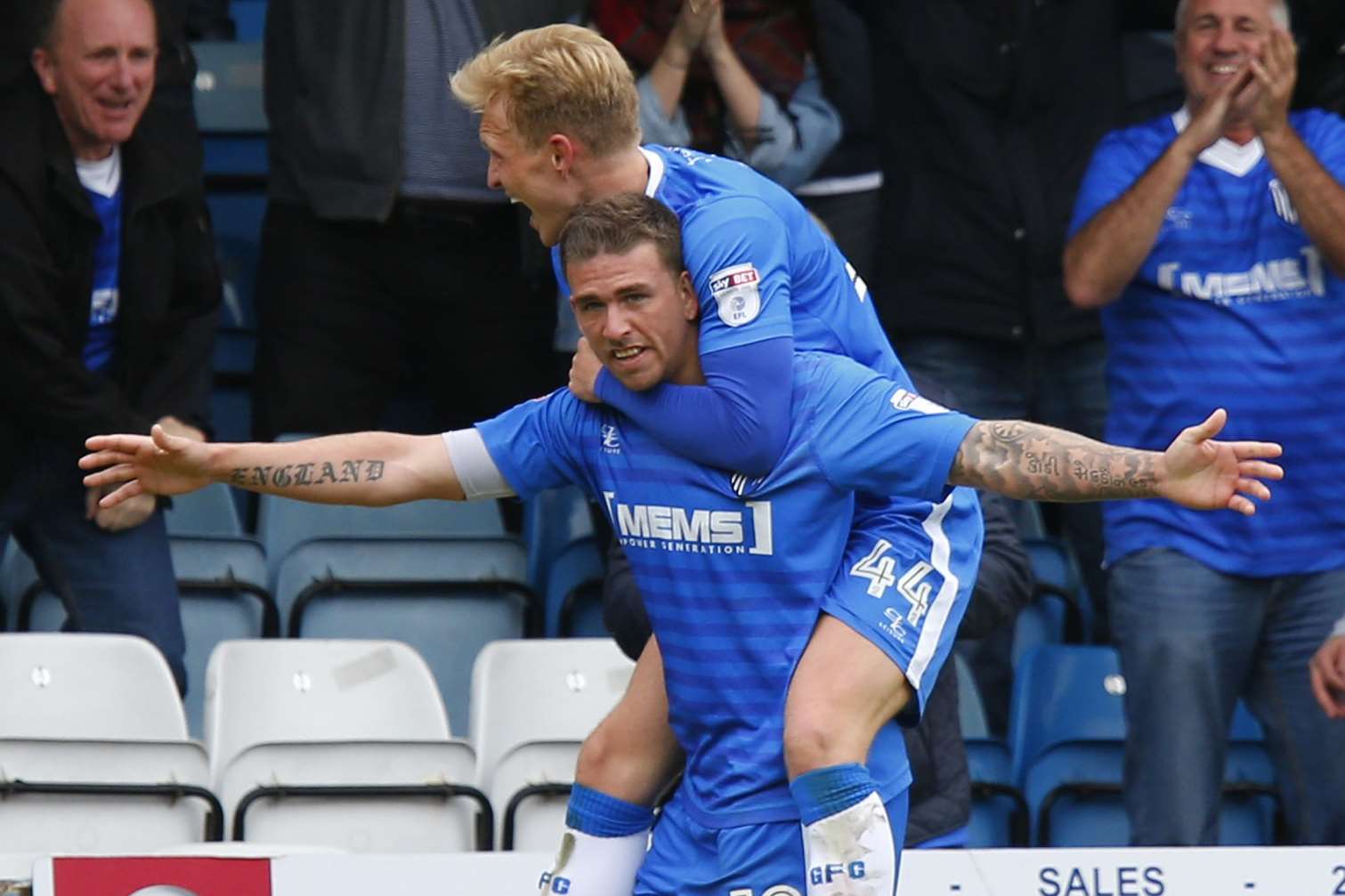 Cody McDonald gives Josh Wright a lift after putting Gills back in front in the last minute Picture: Andy Jones