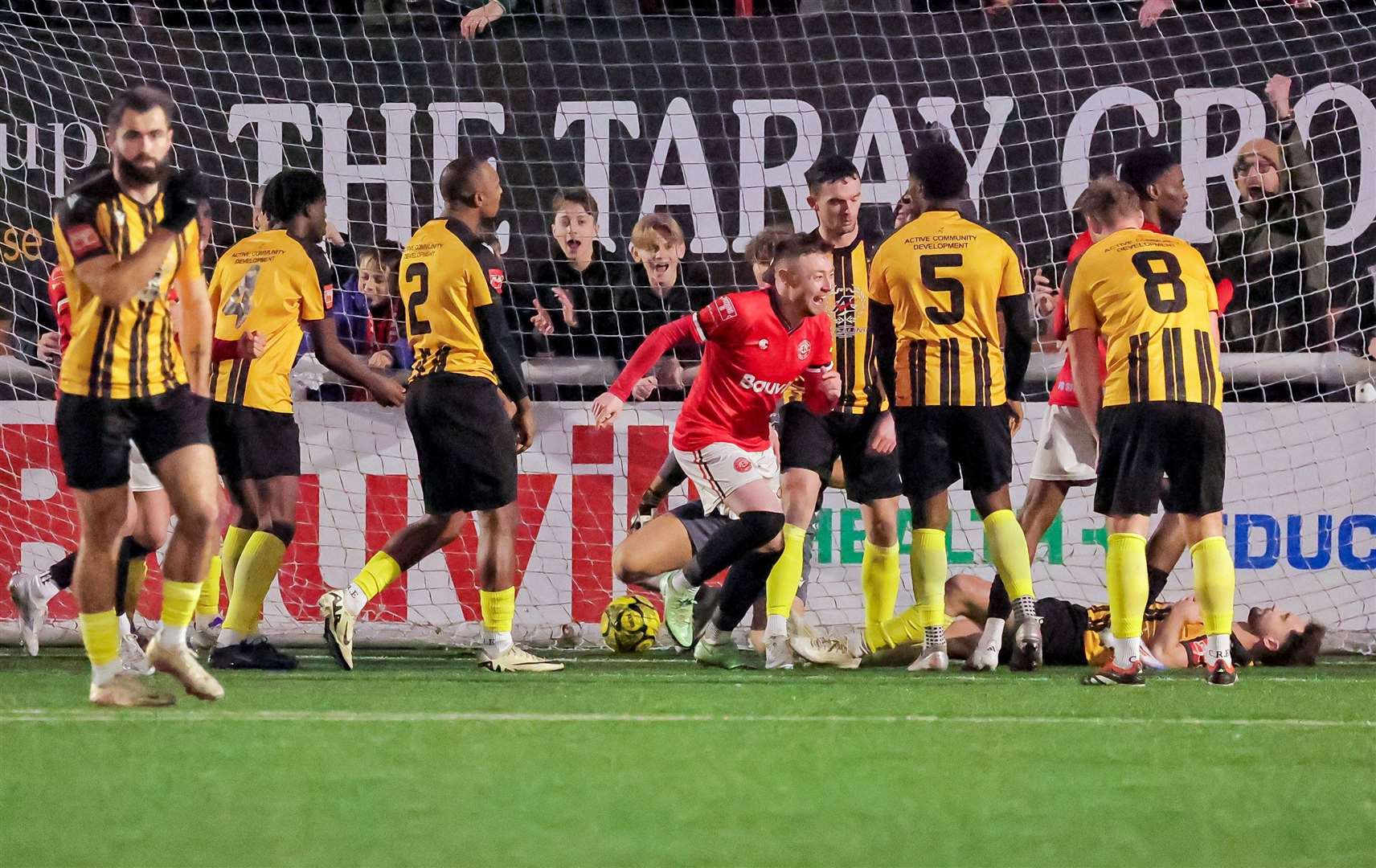 Freddie Sears, centre, celebrates his second as Chatham take a 3-1 lead against Folkestone. Picture: Helen Cooper