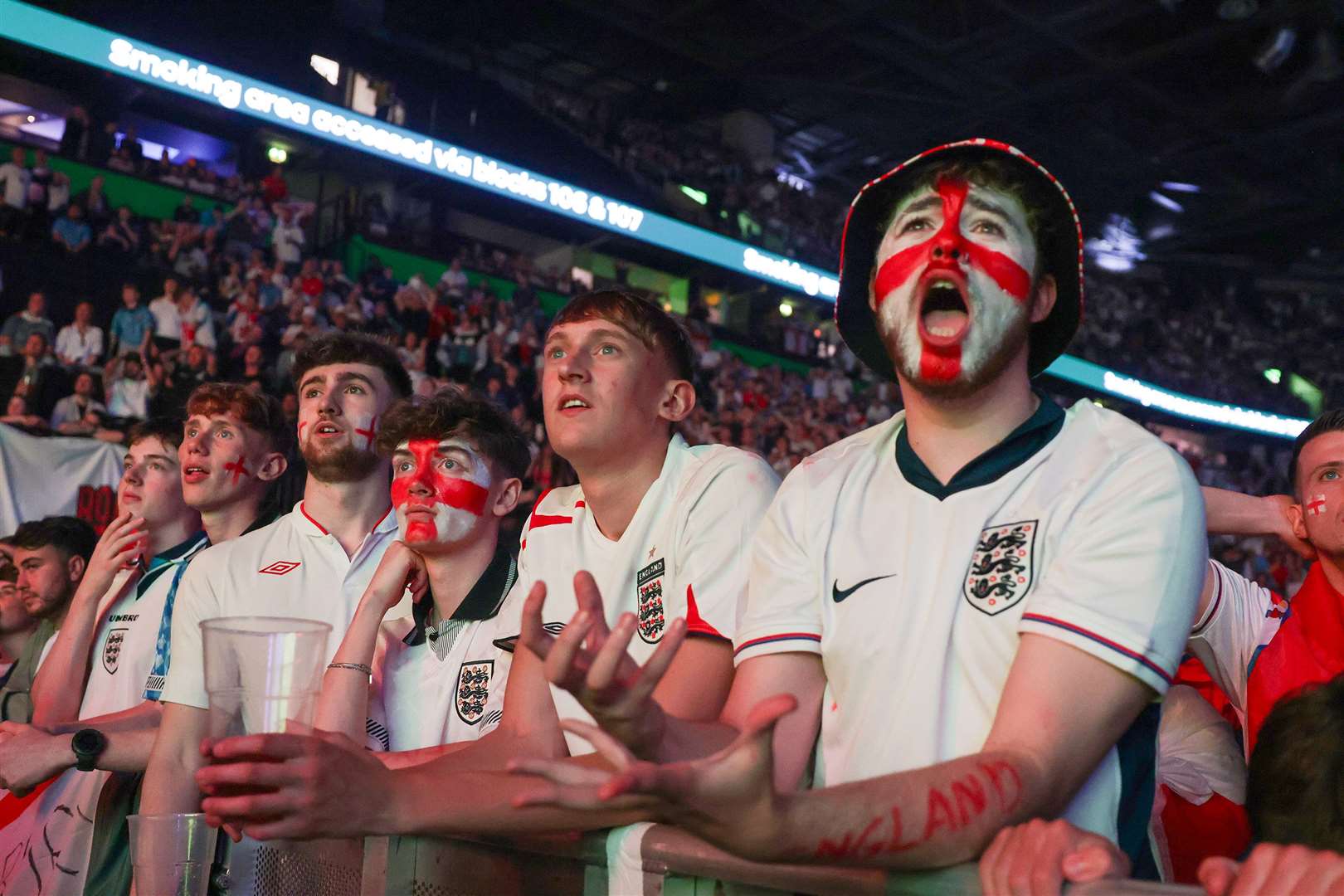 England fans at the AO Arena in Manchester donned the strip and sported painted faces (Ian Hodgson/PA)