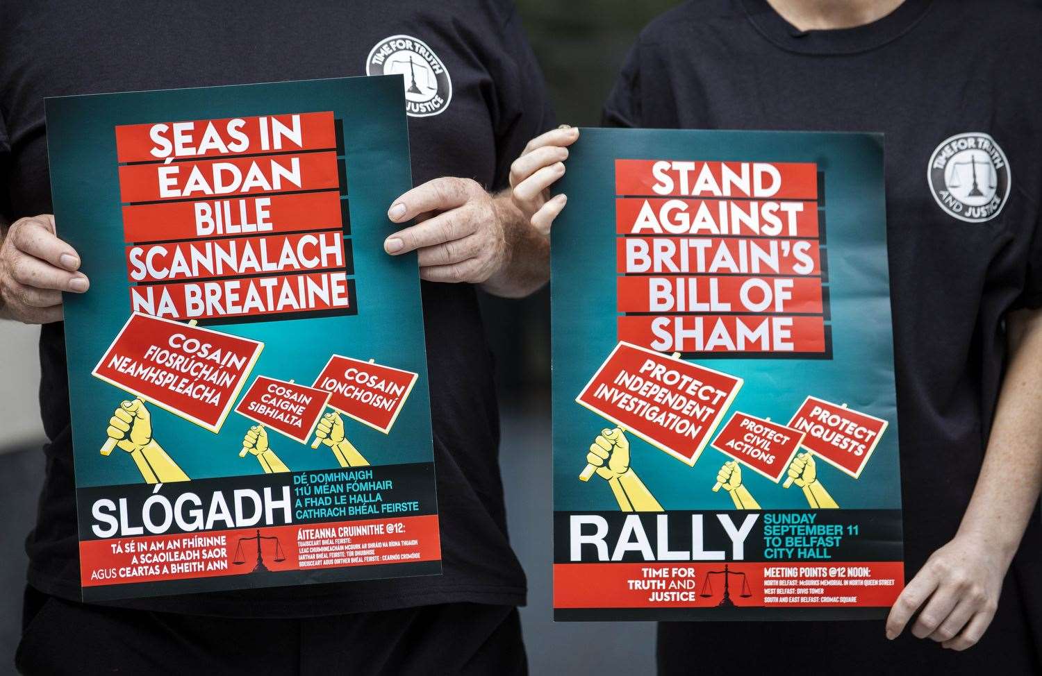 Posters for the Stand Against Britain’s Bill Of Shame Rally (Liam McBurney/PA)