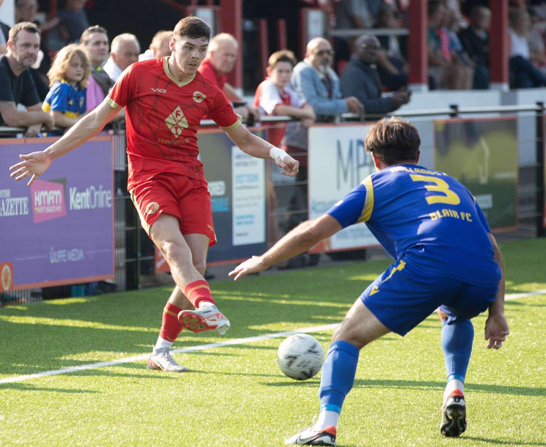 Whitstable striker Harvey Smith up against Hollands & Blair defender George Sheminant, who was with the Oystermen last term. Picture: Les Biggs