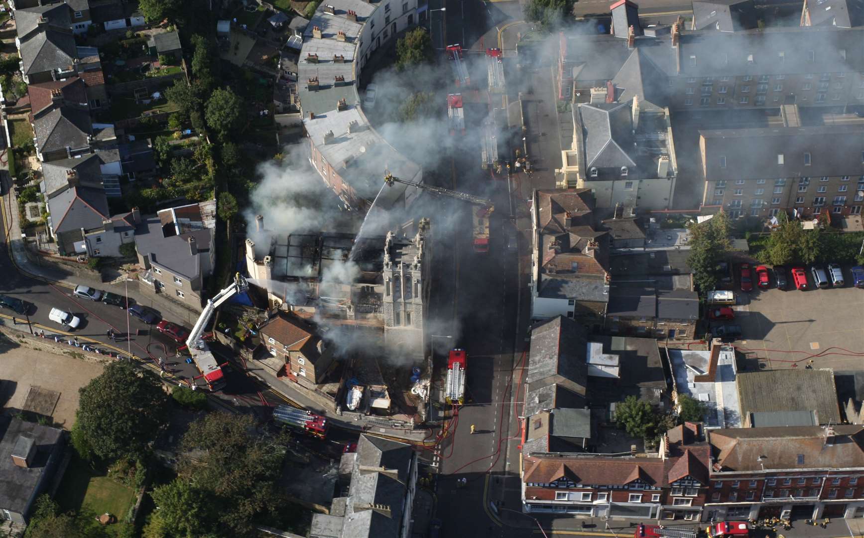 A fire at the St Columbia United Reform Church, Dover in 2007. Planning permission was granted for 16 flats on the site 12 years later, and work began in 2022. Picture: Geoff Hall