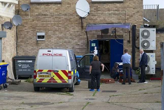 Police at the back of McColl's in Orion Road, Rochester