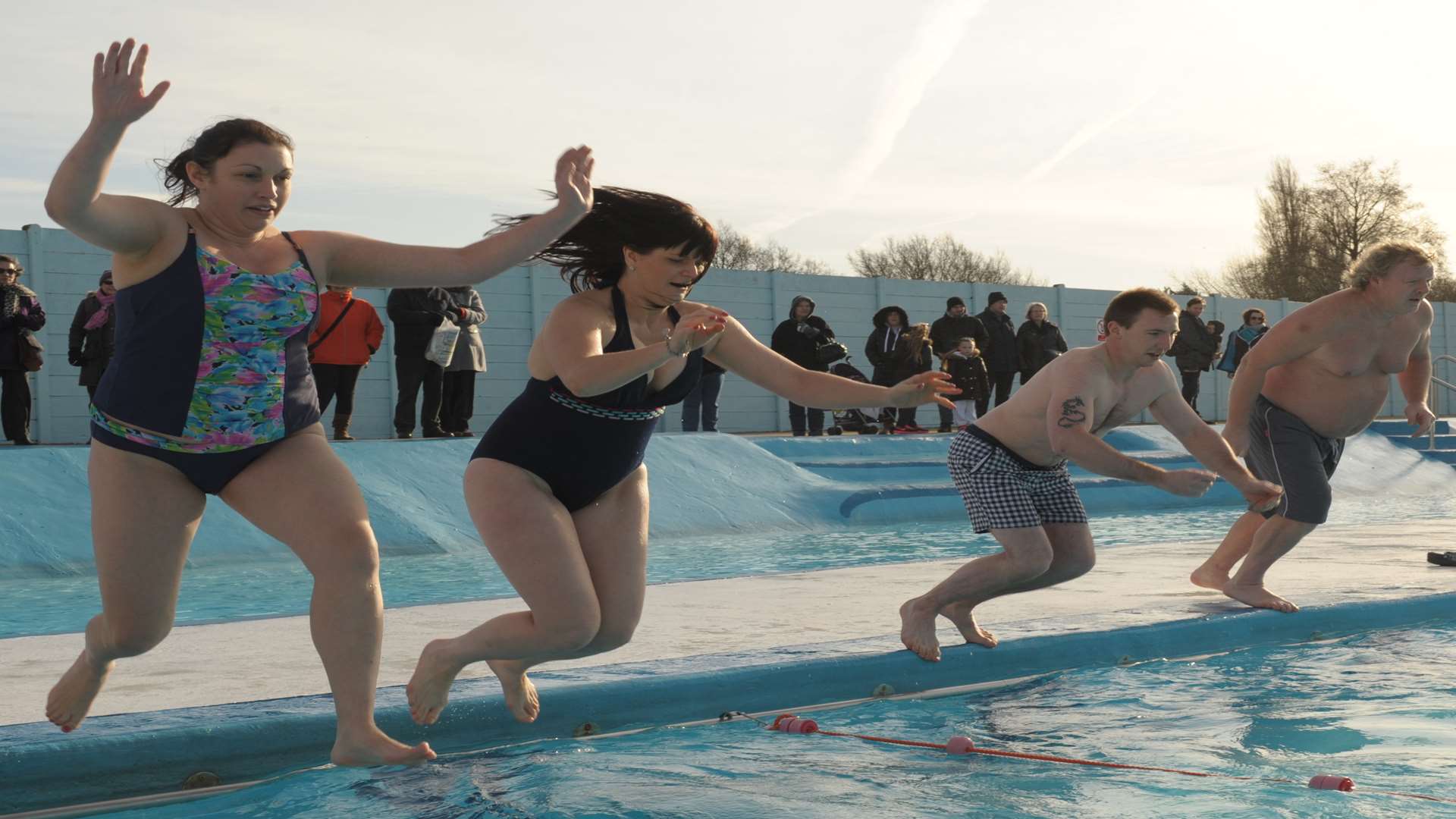 People jumping in The Strand pool