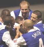 JUMPING FOR JOY: Chris Hope is mobbed by team-mates after scoring the opening goal. Picture: GRANT FALVEY