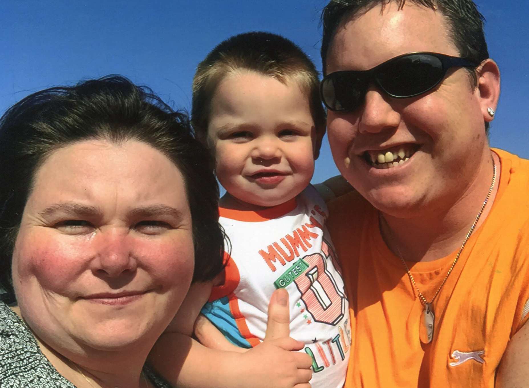 Harley-Jai Smith with his mum Emma and dad Graham.