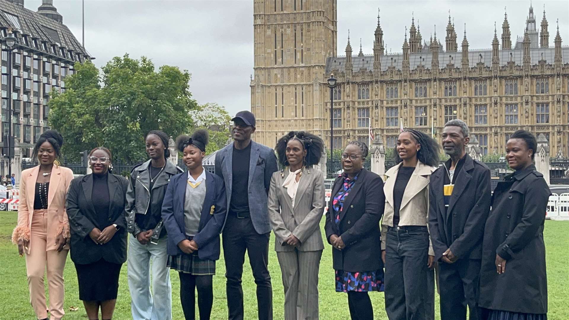 Members of the World Afro Day group outside Parliament as they called for Afro hair to be made a protected characteristic under the 2010 Equality Act (Claudia Savage/PA)