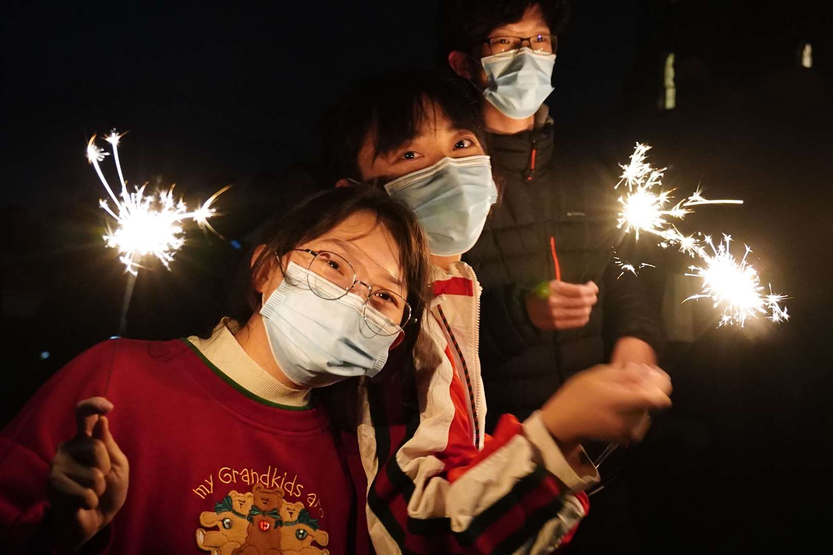 Visitors from China celebrate on Calton Hill (Jane Barlow/PA)