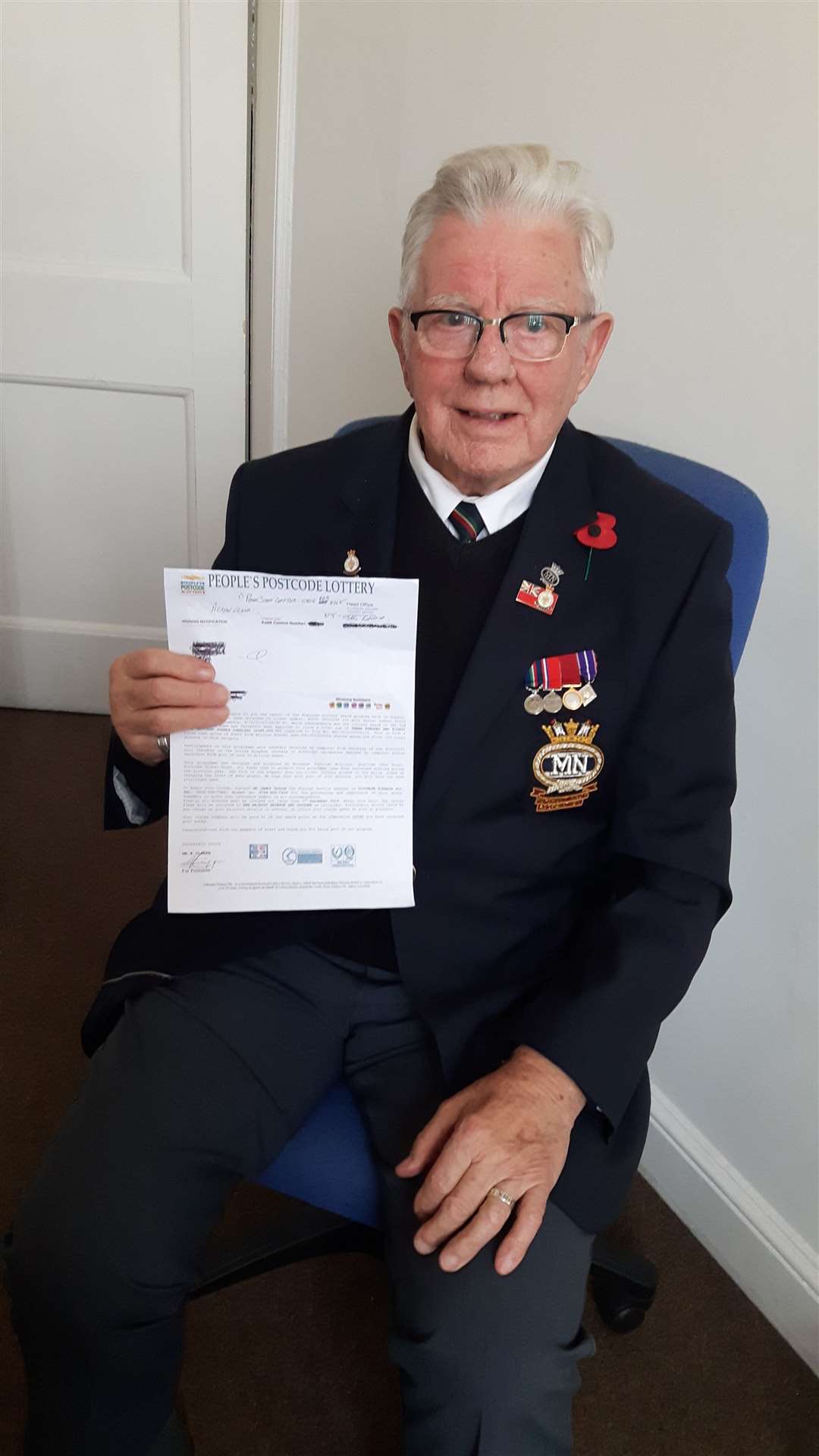 Laurence Stroud, a Merchant Navy veteran of the Cold War, narrowly escaped being conned out of £2,350 by a man pretending he had won the People's Postcode Lottery. He is pictured with the bogus letter