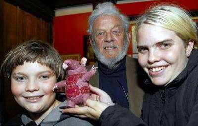 Museum of Canterbury 40th Birthday of the Clangers. Creator Peter Firmin centre with Michael Woodrow, with his sister Laura and one of the Clangers.