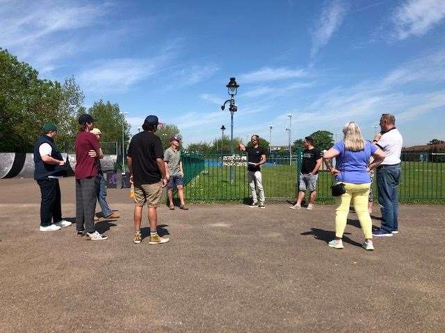 Skate park designer Russ Holbert, far centre, discusses the proposals with local park users and councillors