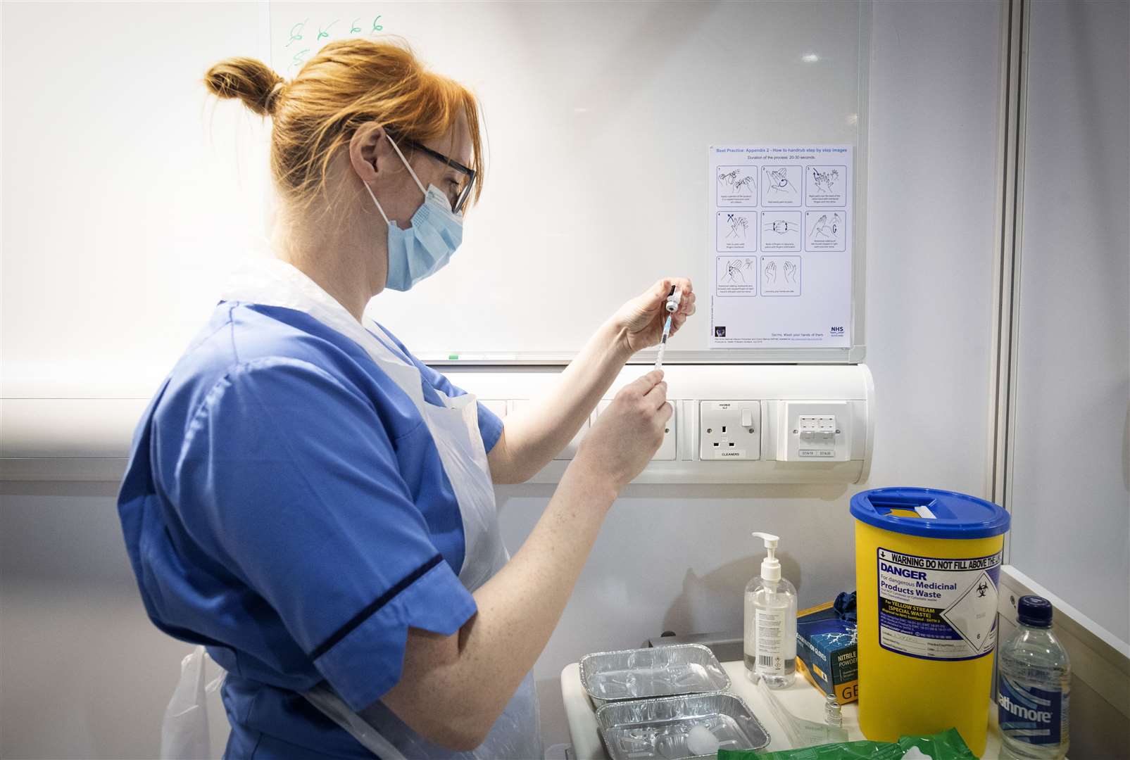 A nurse prepares a coronavirus vaccine (Jane Barlow/PA)