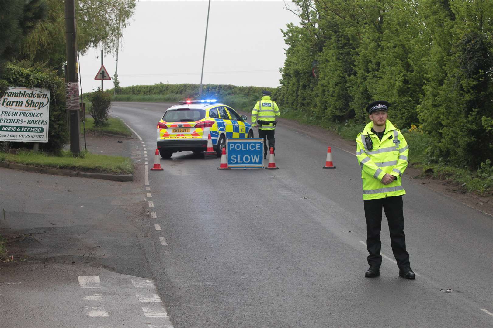 Police stop traffic along the Lower Sheppey road, near Brambledown Farm Shop, because of an accident over the brow of the hill