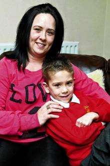 Max Walsh, seven, with his mum Nicole is trying to raise £43,000 for an operation in America, which will help him walk