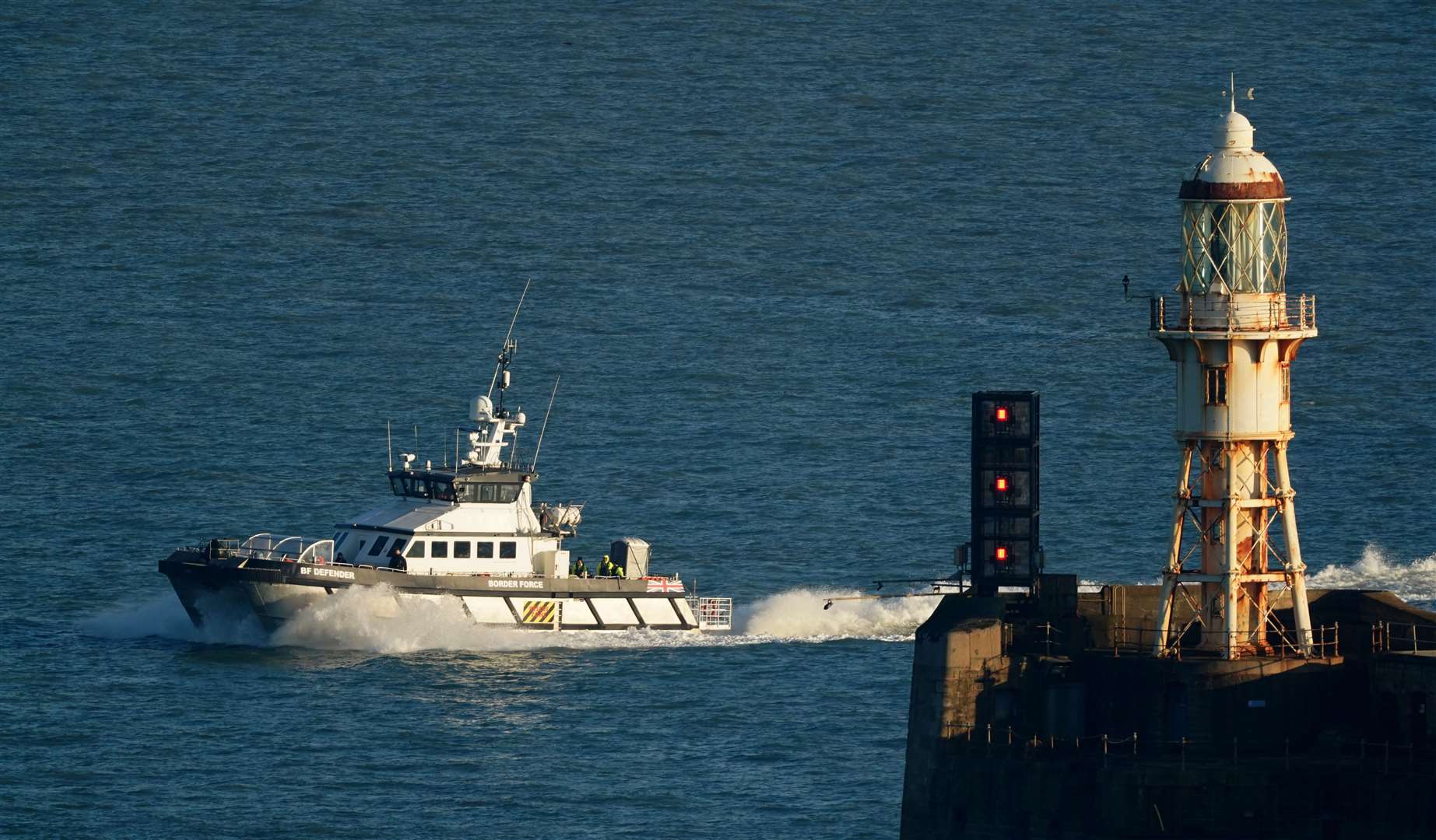 A group of people are brought in to Dover onboard a Border Force vessel (Gareth Fuller/PA)