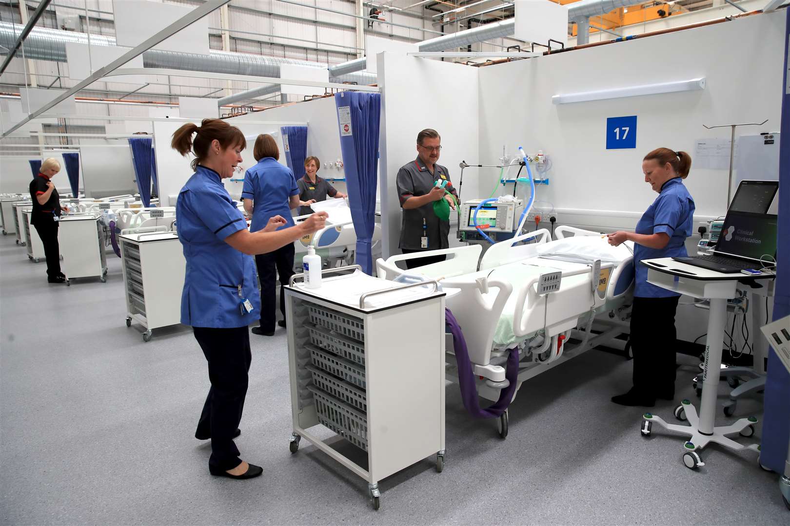 Staff prepare bays at the NHS Nightingale North East (PA)