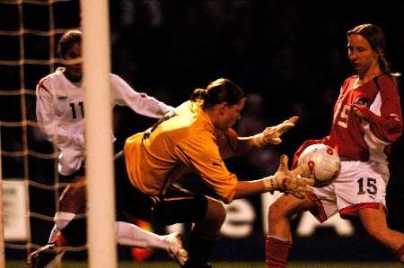 Rachel Yankey sees her shot saved by keeper Bianca Reischer