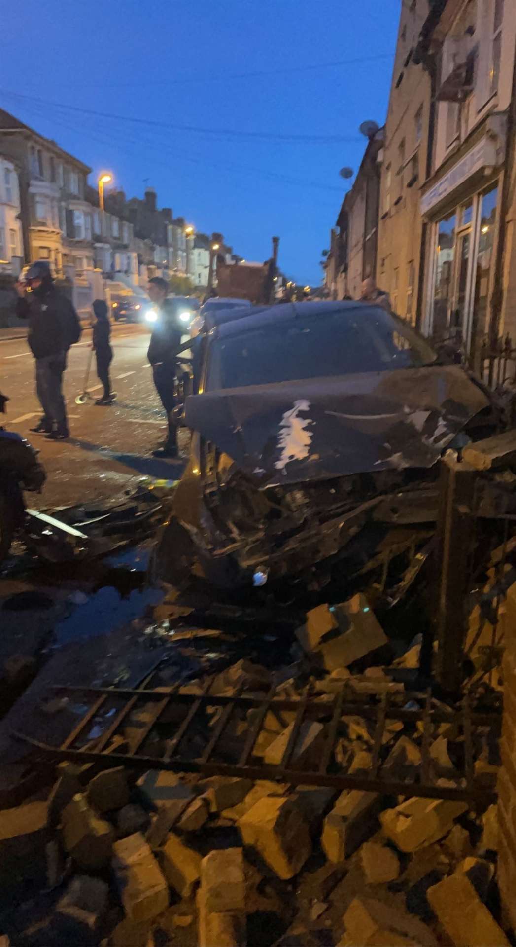 A wall outside a house was destroyed in the crash