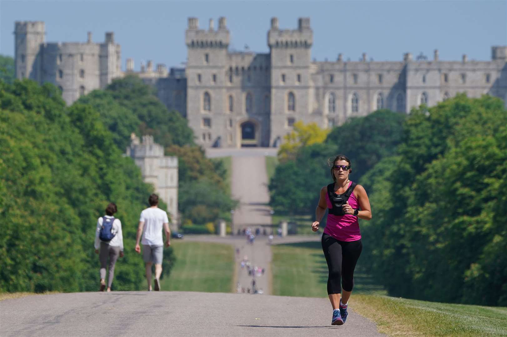 People enjoying the warm weather while on the Long Walk in Windsor, Berkshire (Jonathan Brady/PA)