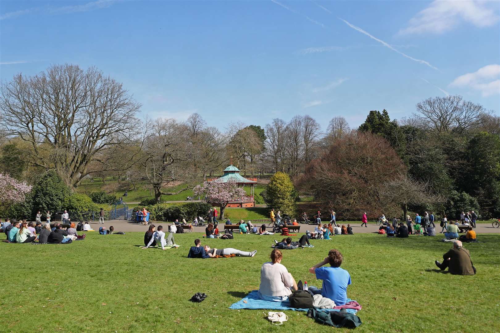 People enjoy the sunny weather in Sefton Park, Liverpool (Peter Byrne/PA)