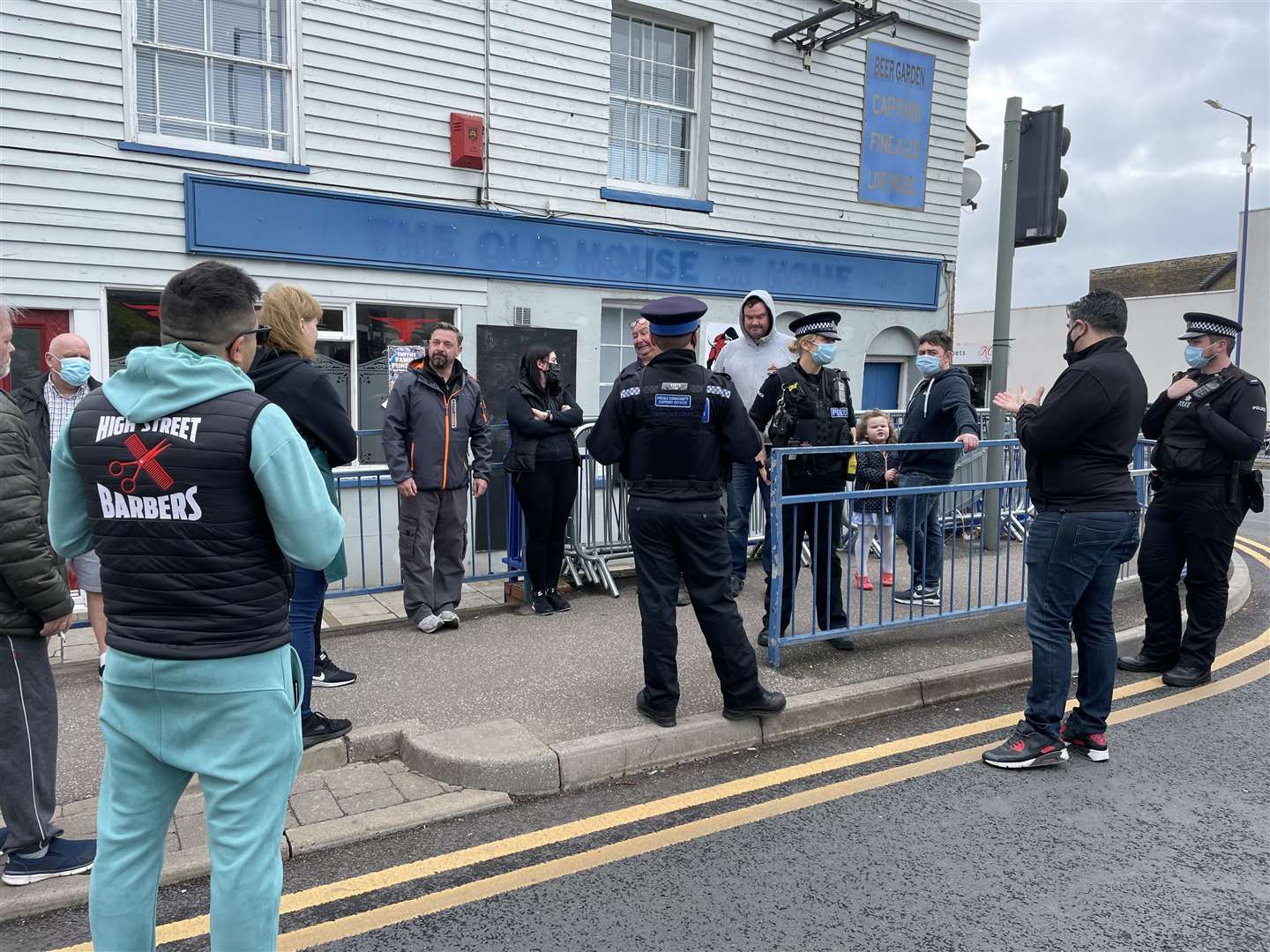 Officers talking to business owners during the protest this morning