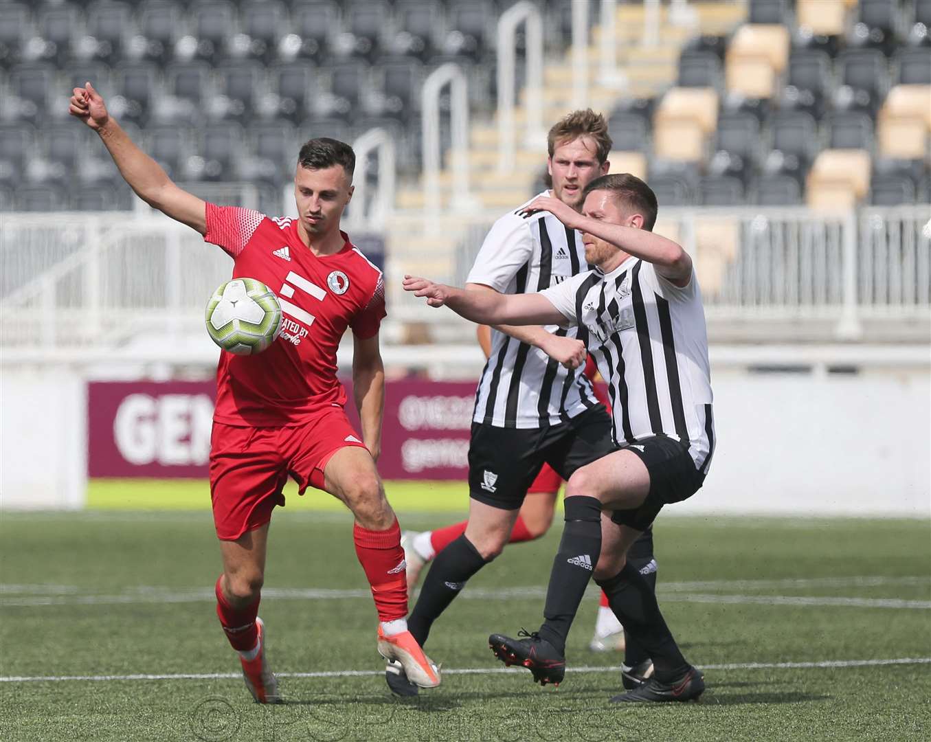 Kent Junior B Cup final action between Selhurst (red) and Chiham (stripes) Picture: PSP Images