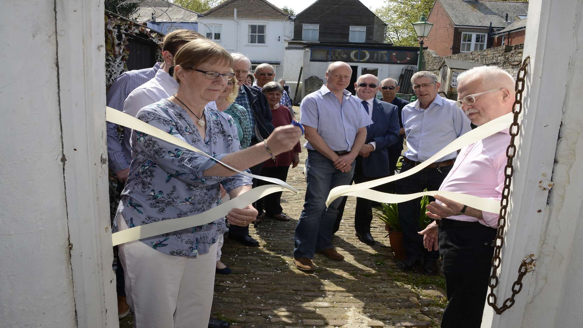Joanne Turpin who donated one of her fathers' models Soverein of the Sea, cuts the ribbon.