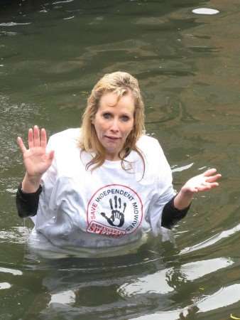 Midwife Virginia Howes makes a splash to highlight a threat to the profession. Pictures: Matt Hoople