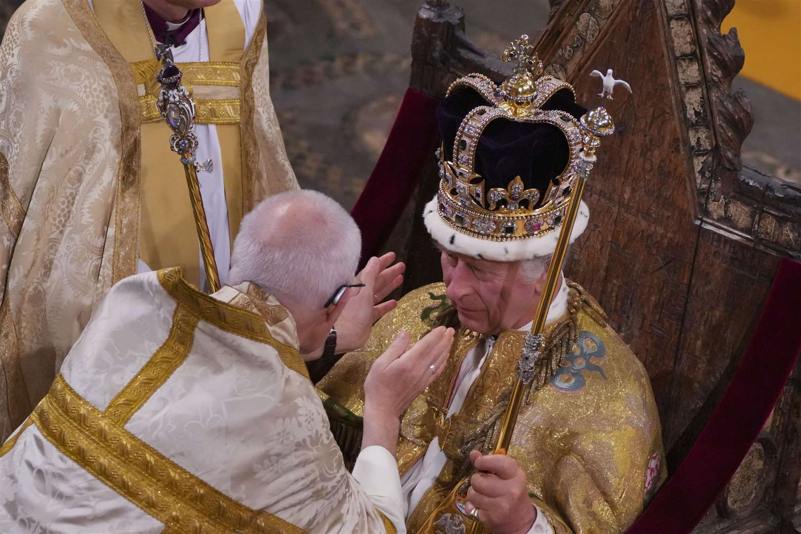 The King is crowned with St Edward’s Crown by the Archbishop of Canterbury in Westminster Abbey (Aaron Chown/PA)