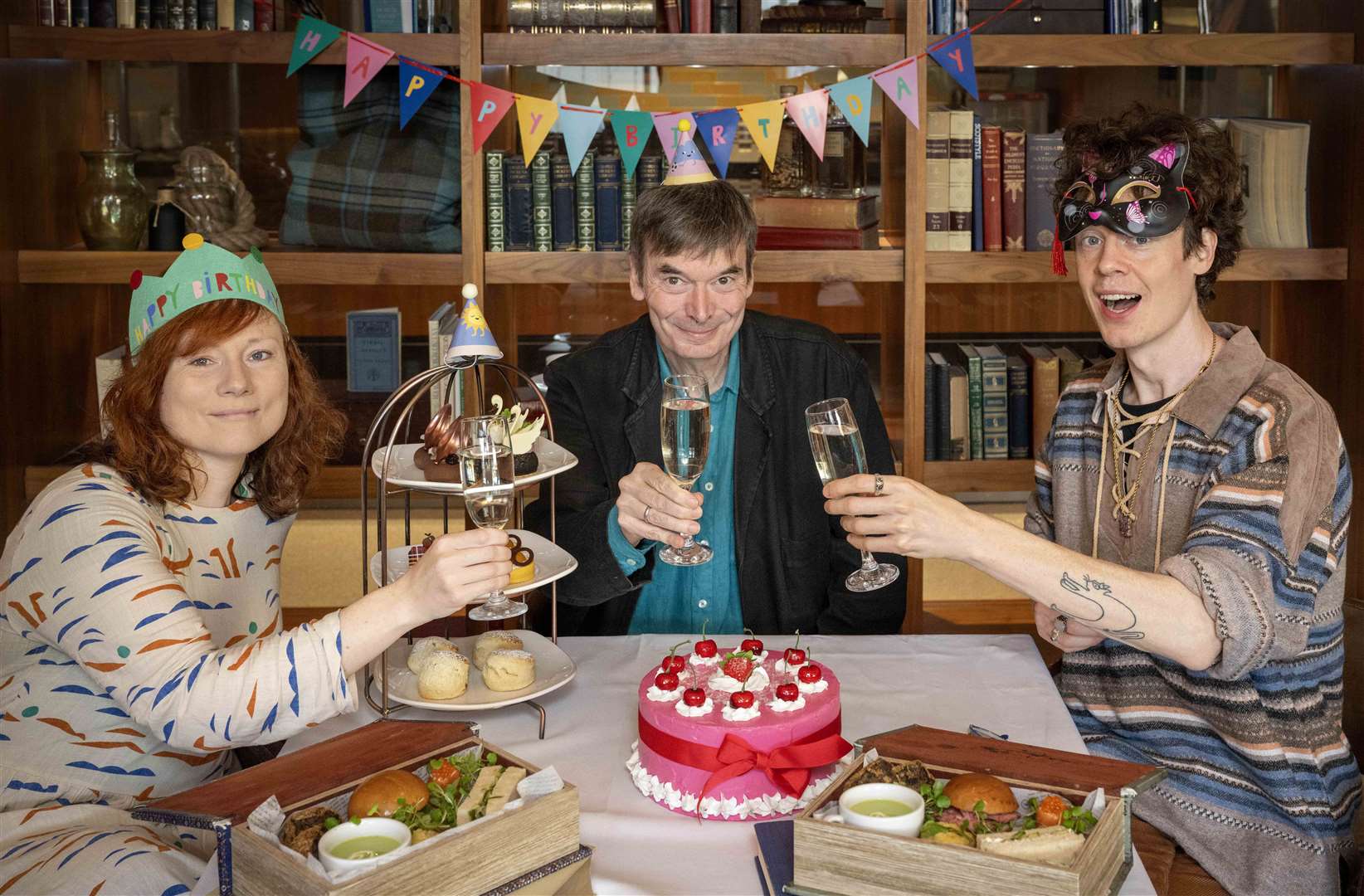 Keira Brown of the Edinburgh City of Literature Trust, author Ian Rankin, centre, and Edinburgh Makar Michael Pederson celebrate the anniversary (Neil Hanna/PA)