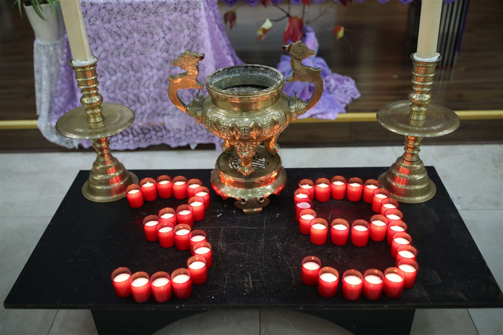 Candles laid out as part of the ceremony for the mass prayer and vigil for the 39 victims found dead inside the back of a truck (Yui Mok/PA)