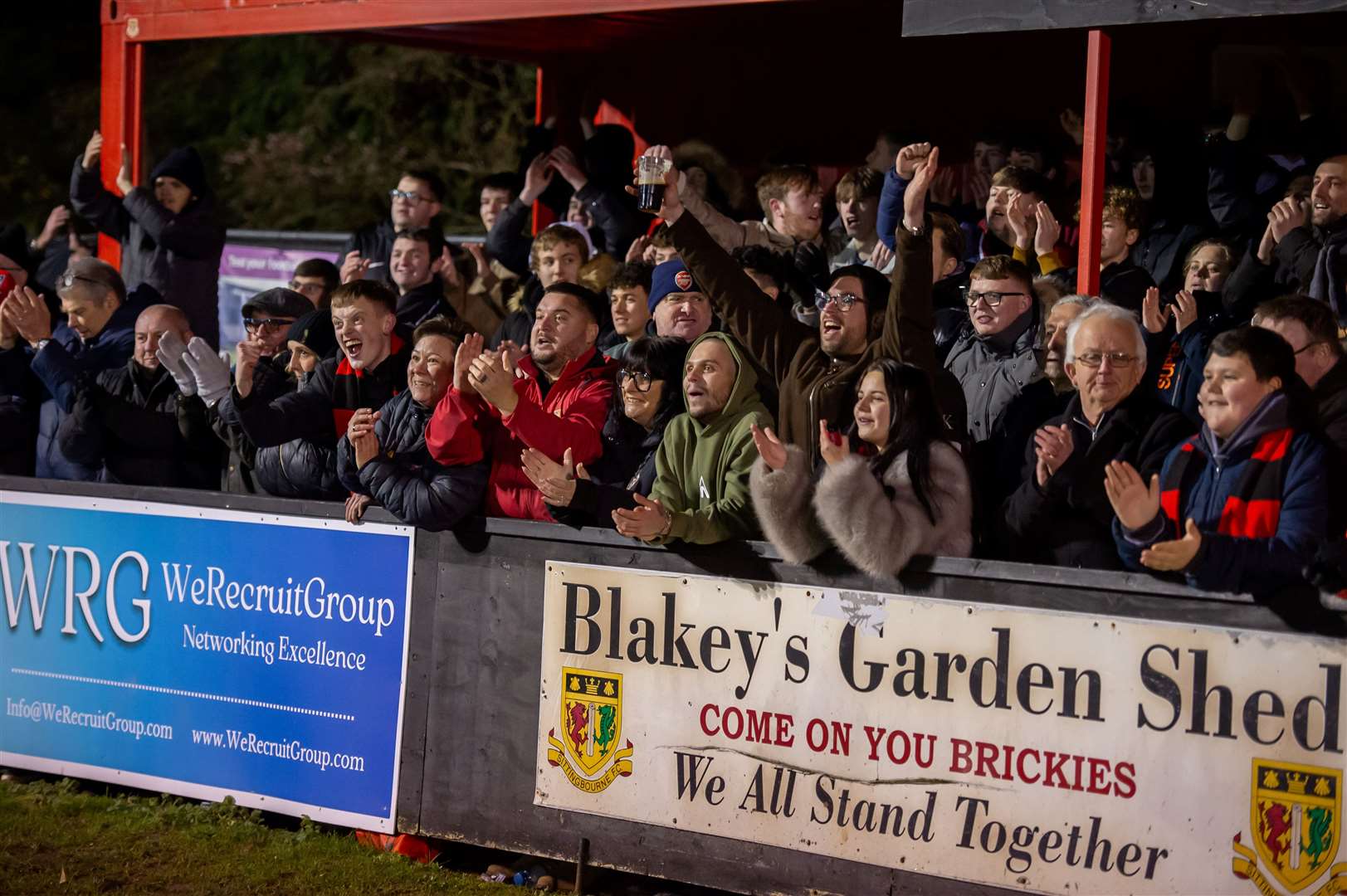 Sittingbourne fans celebrate at full-time after seeing their side beat Salisbury. Picture: Ian Scammell