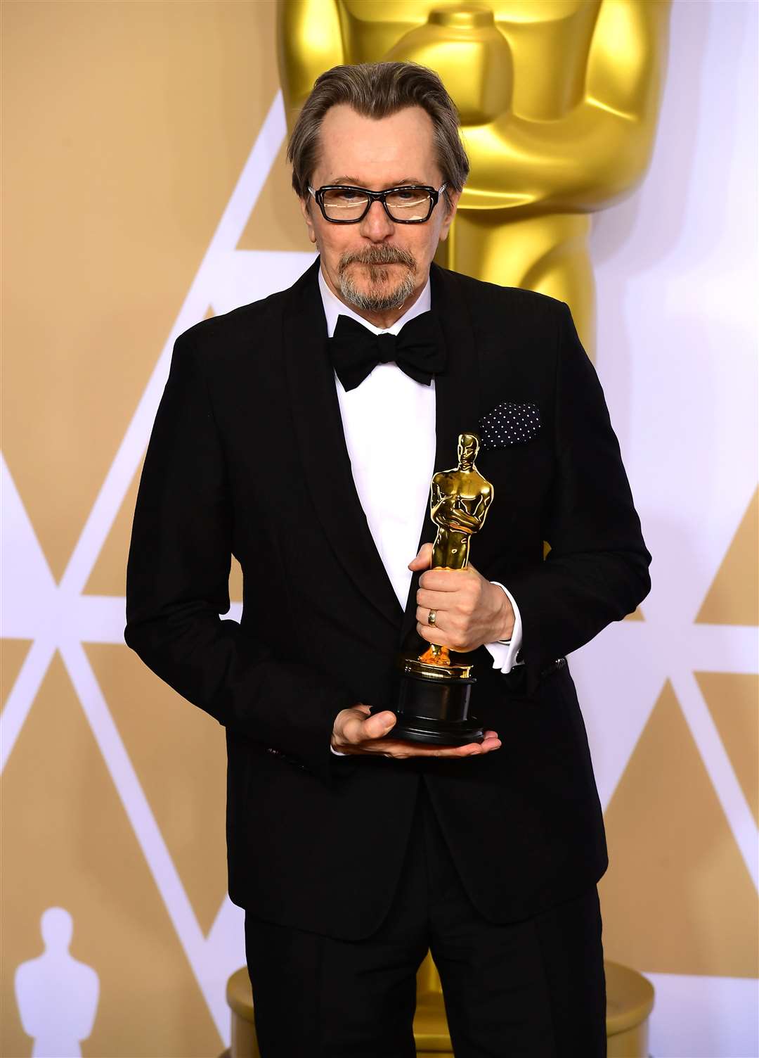 Gary Oldman with his best actor Oscar for Darkest Hour (Ian West/PA)