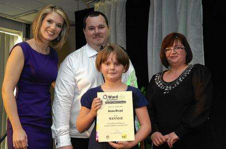 Anna Broad, winner of Brave and Inspiring Children between 6-11 years old, presented by Vikki Read, winner of the courageous family award in 2008.