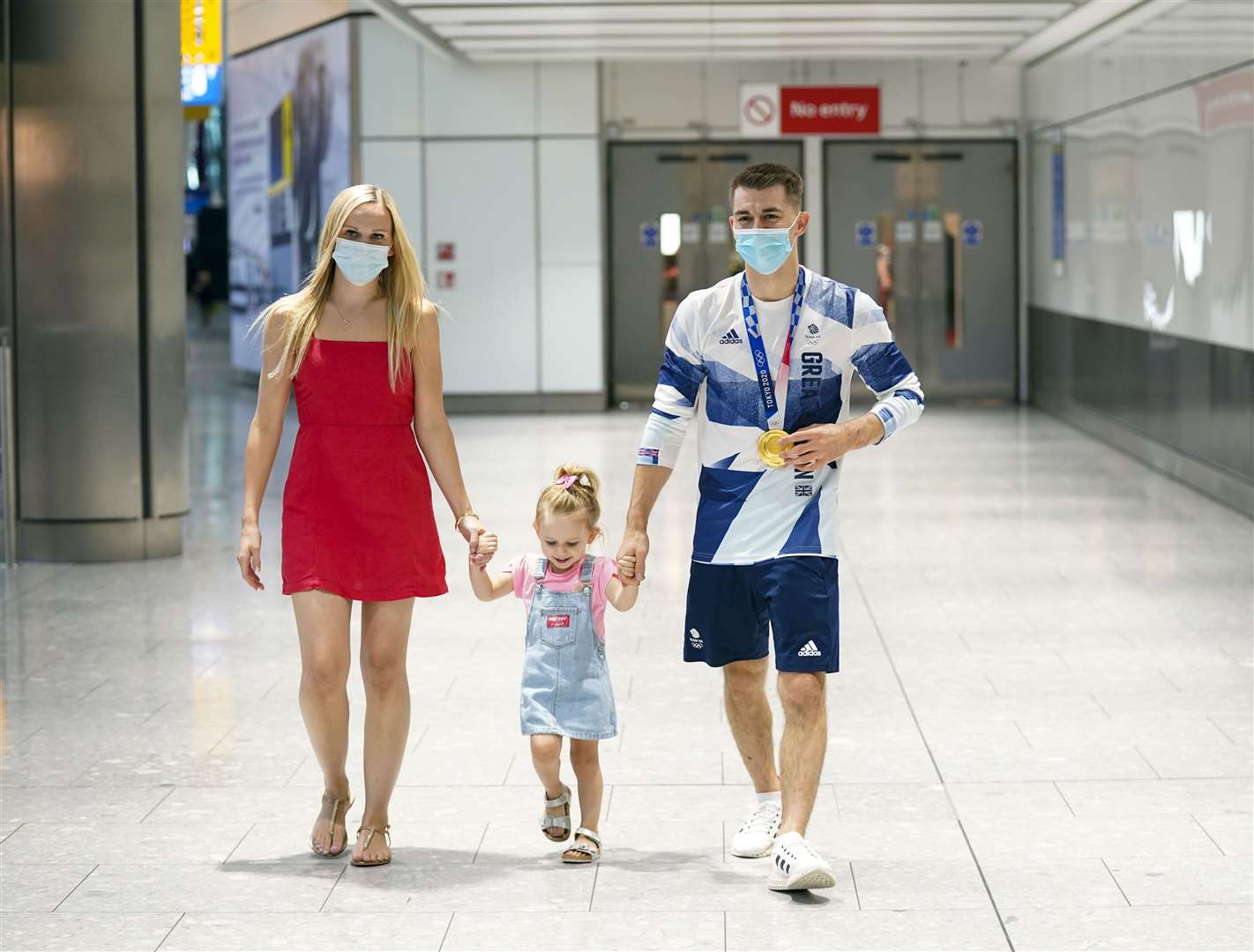 Max Whitlock with his wife Leah and daughter Willow (Steve Parsons/PA)