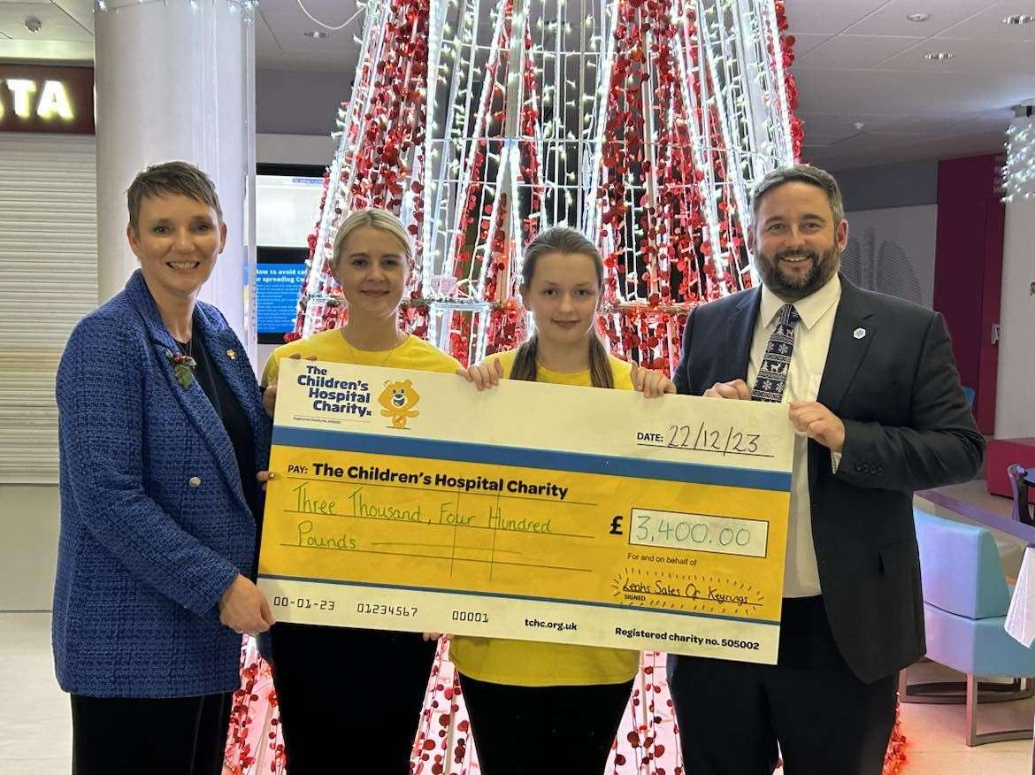 Leah presenting a cheque to Sheffield Children’s Hospital (Craig Walton/PA)