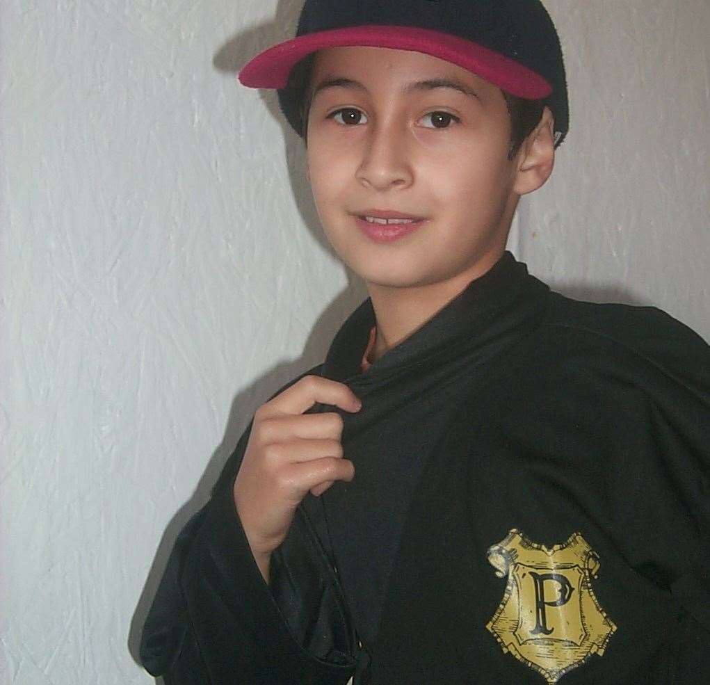 Omar Al Khina, 10, at the preview screening of Harry Potter in Canterbury, with his Hogwarts robes