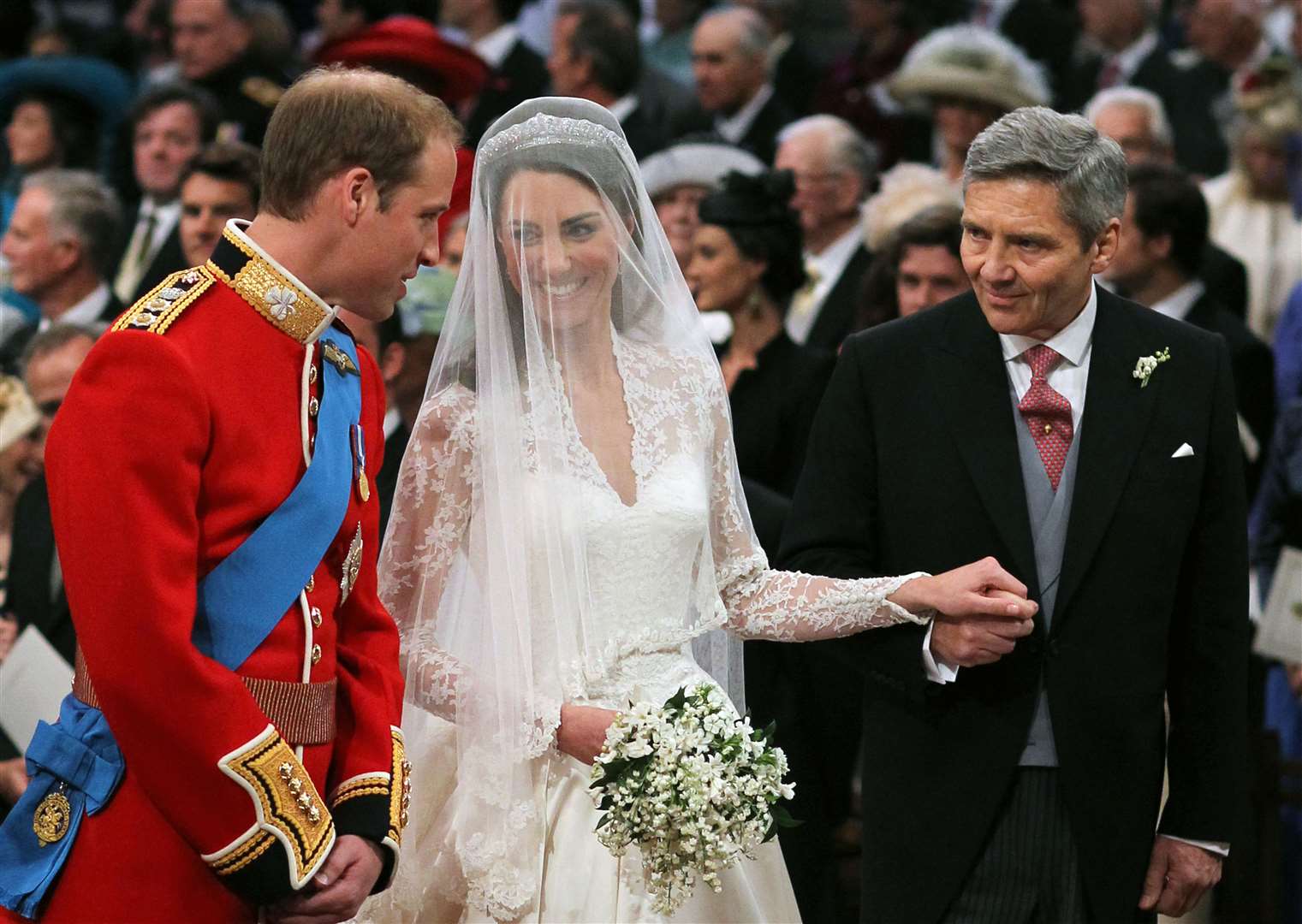 William and Kate with her father Michael Middleton during the service (Dominic Lipinski/PA)