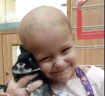 Bethany holding a rabbit at a pet shop. Picture from Facebook courtesy of the Chesterton family