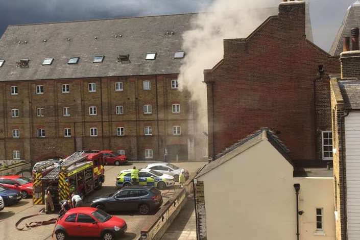 Smoke billows from the back of the property. Picture: Frankie Savage