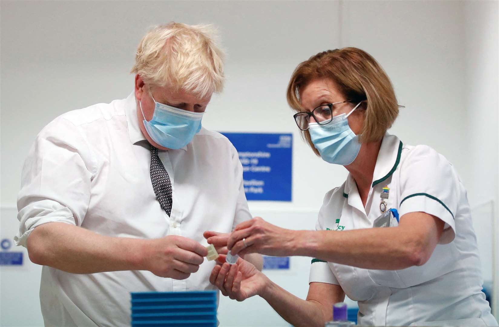 Prime Minister Boris Johnson Boris Johnson with advanced pharmacy technician Jane Hosea, during a visit to a vaccination centre in Northamptonshire (Peter Cziborra/Reuters/Pool)