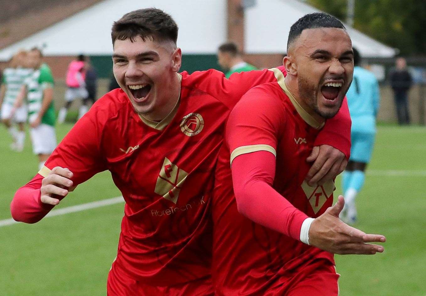 Harvey Smith and two-goal Whitstable striker Dean Grant celebrate during last weekend’s 3-3 draw with Corinthian. Picture: Les Biggs