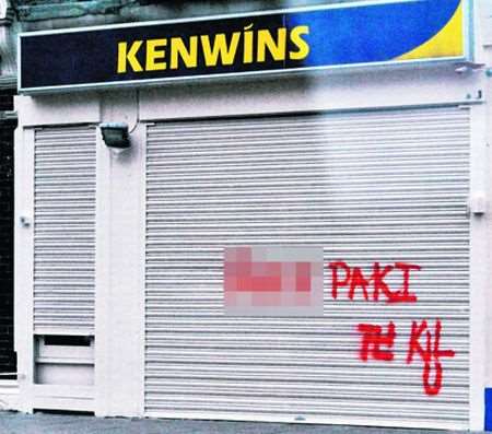 The racist graffiti sprayed on the shop front of Kenwins Newsagents