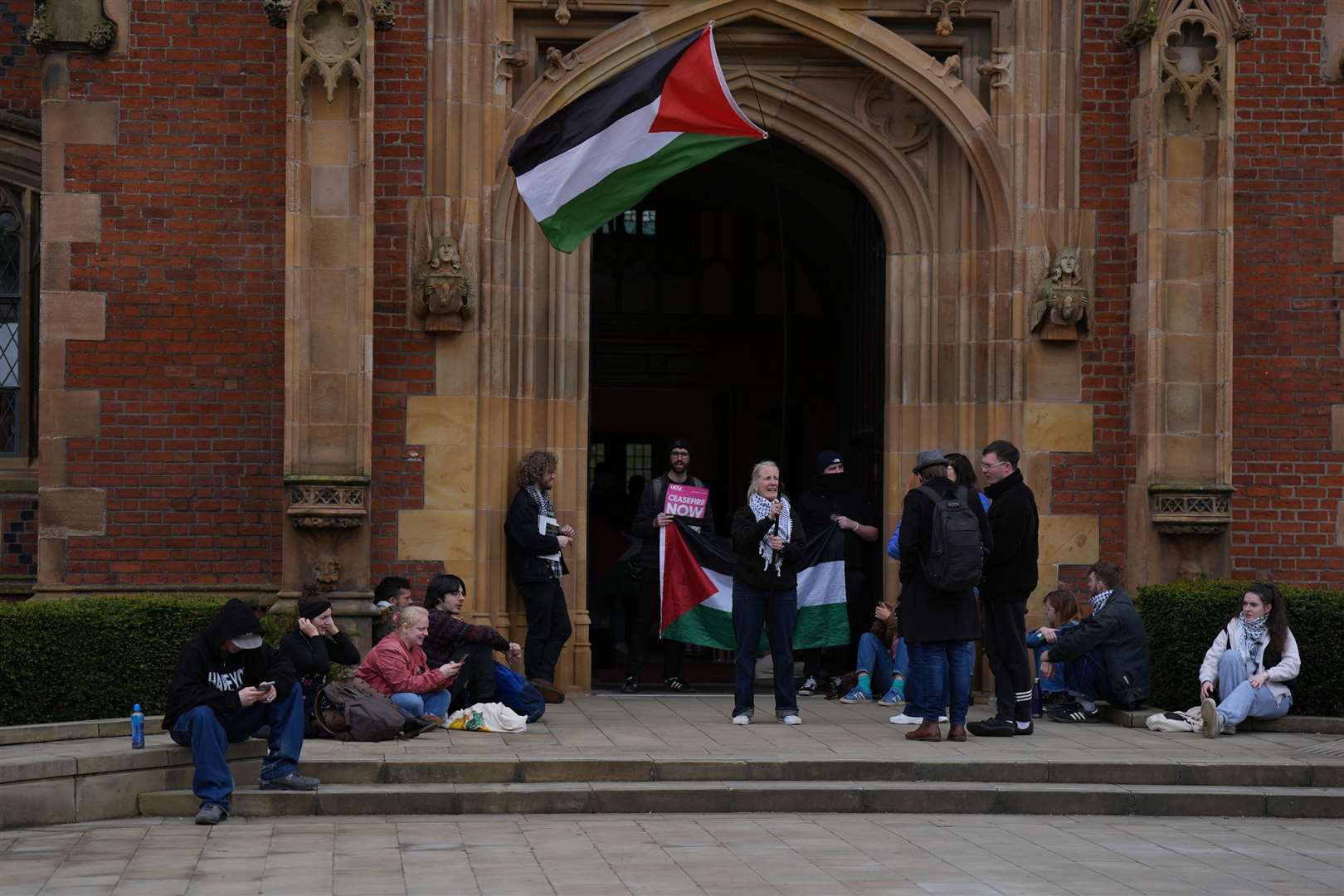 Members of the Queen’s University Belfast Palestine Assembly hold a ‘sit in’ in the main Lanyon building of the campus in Belfast on Tuesday (Niall Carson/PA)